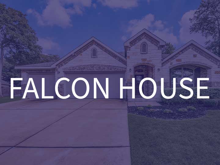 The brick Falcon House with two garages for TDY stays available through TDY Haven Crash Pad in Schertz, TX